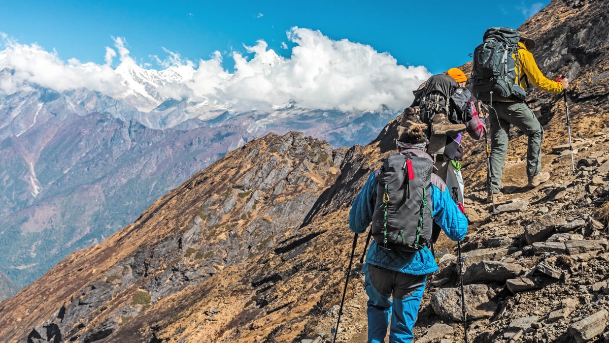 Trekkers on the Annapurna Circuit with Himalayan peaks, Nepal