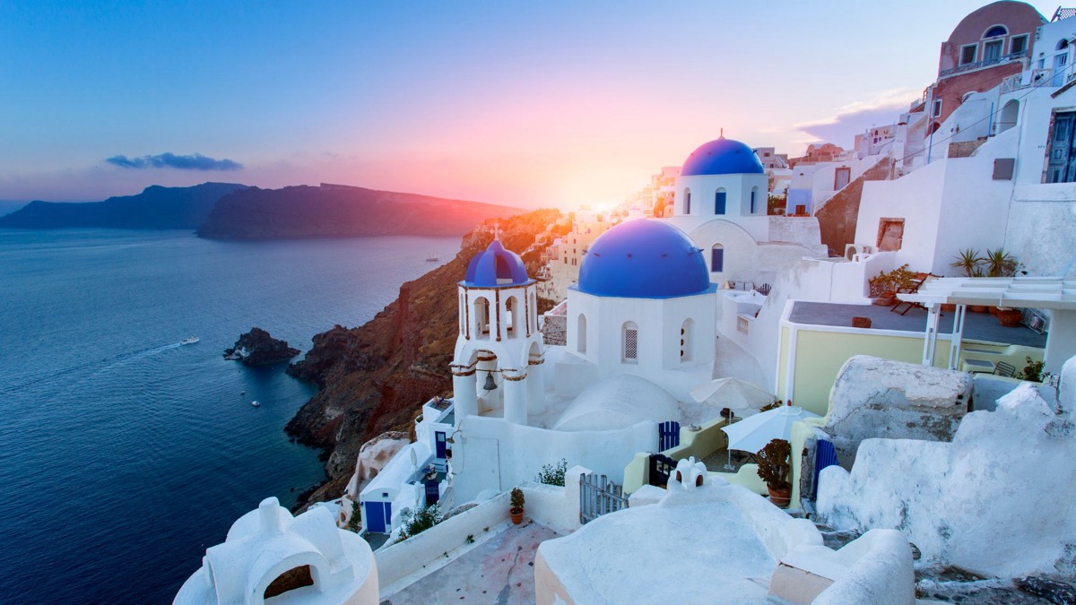 Santorini blue domes at sunset, Greece