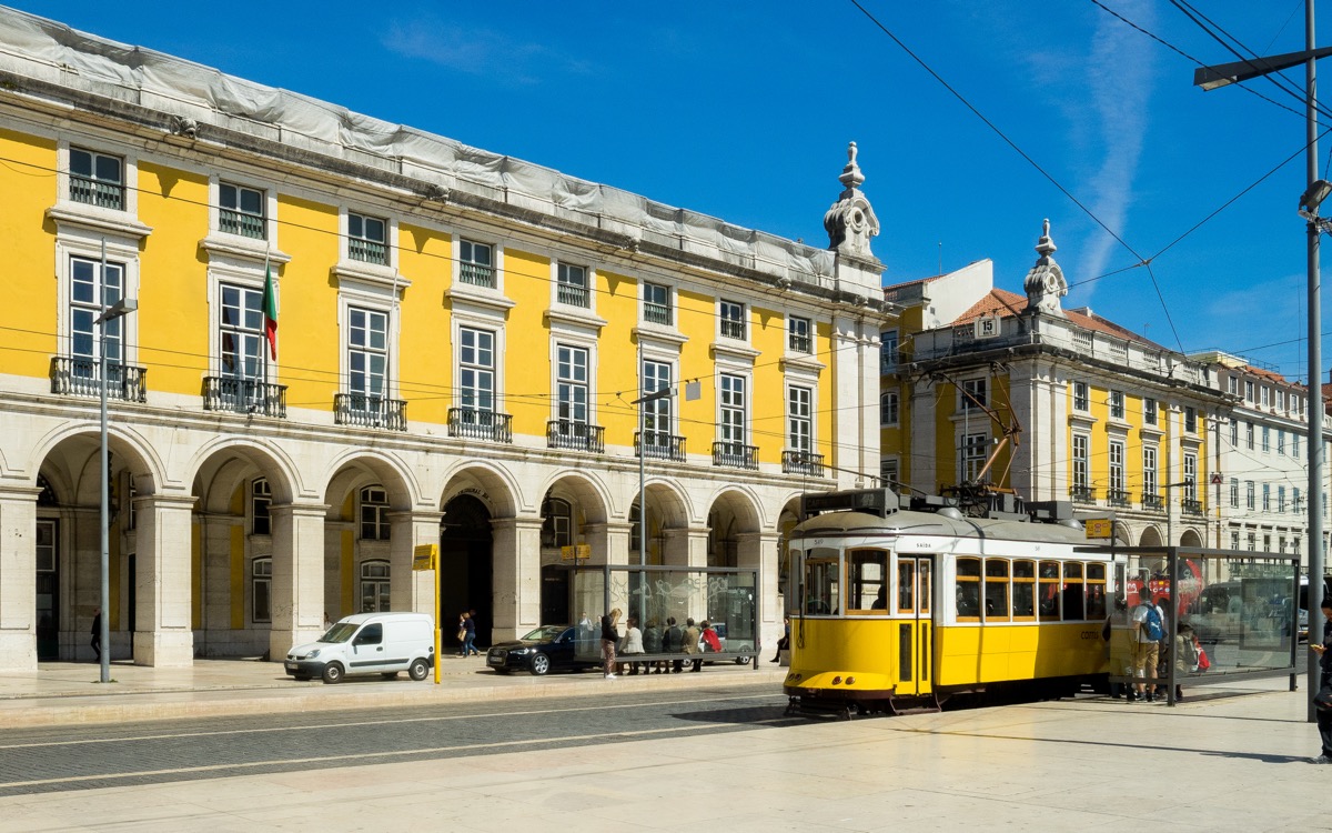 Tram 28 on a Lisbon street in autumn