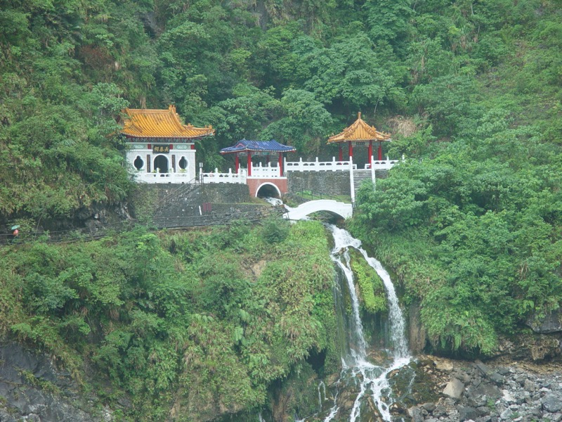 Eternal Spring Shrine at Taroko Gorge with waterfall flowing beneath a red shrine built into a cliff face