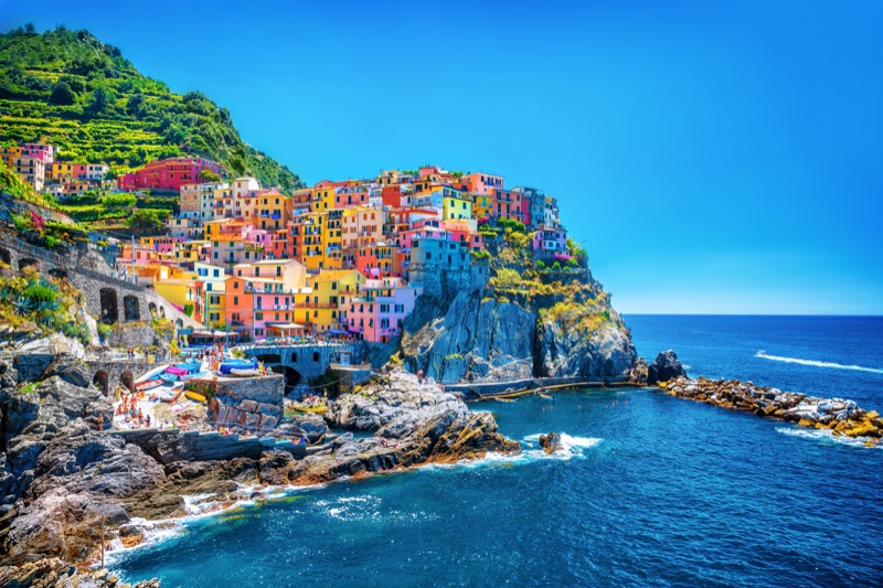 Cinque Terre's five colorful fishing villages clinging to steep terraced cliffs above the Ligurian Sea