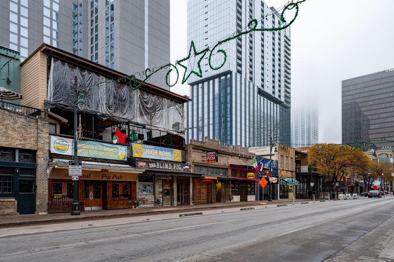 6th Street in Austin Texas at night with neon lights and live music venues