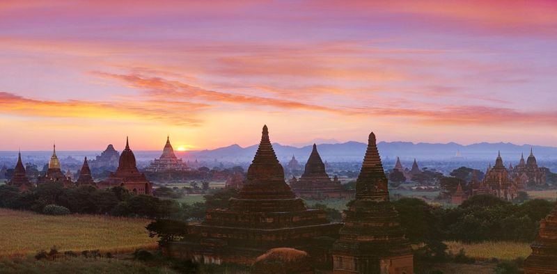 Bagan Myanmar — thousands of ancient pagodas and temples stretching across the plain at sunrise