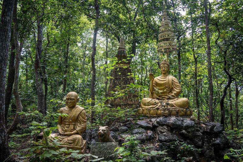 Luang Prabang temple — golden Wat Xieng Thong with ornate mosaic walls and sweeping roofline