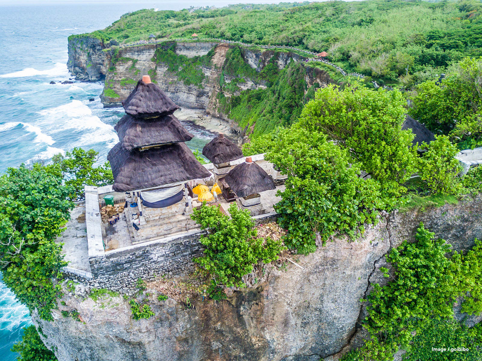 Uluwatu Temple perched on a dramatic cliff overlooking the Indian Ocean in Bali