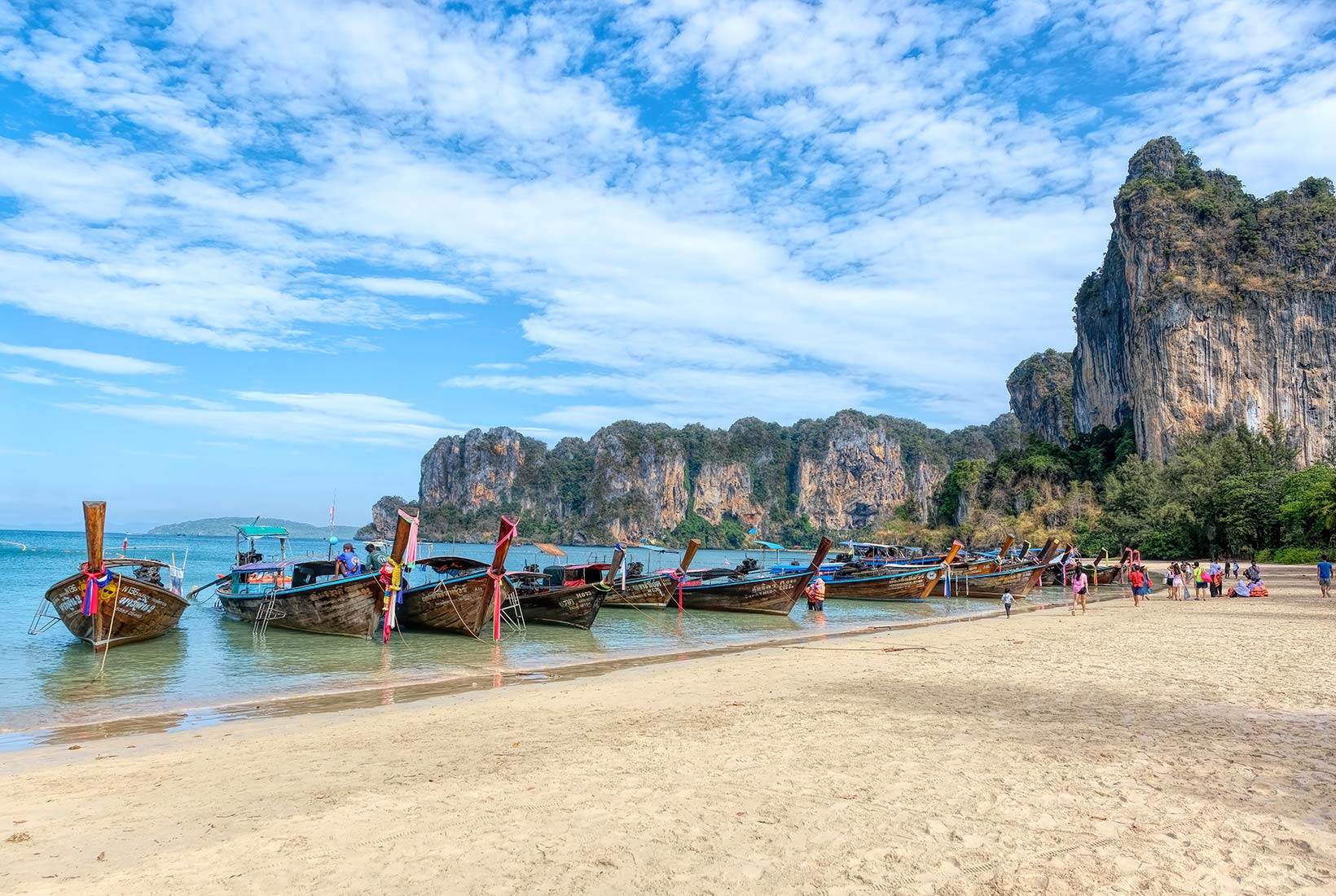 Railay Beach, Krabi, Thailand — dramatic limestone cliffs above crystal-clear turquoise water