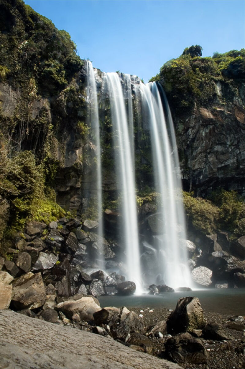 Jeju Island Jeongbang waterfall spilling directly into the sea