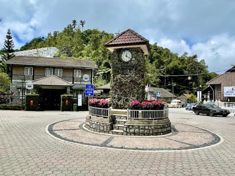 Fraser's Hill clock tower — colonial-era landmark in Brinchang, Pahang Malaysia surrounded by jungle