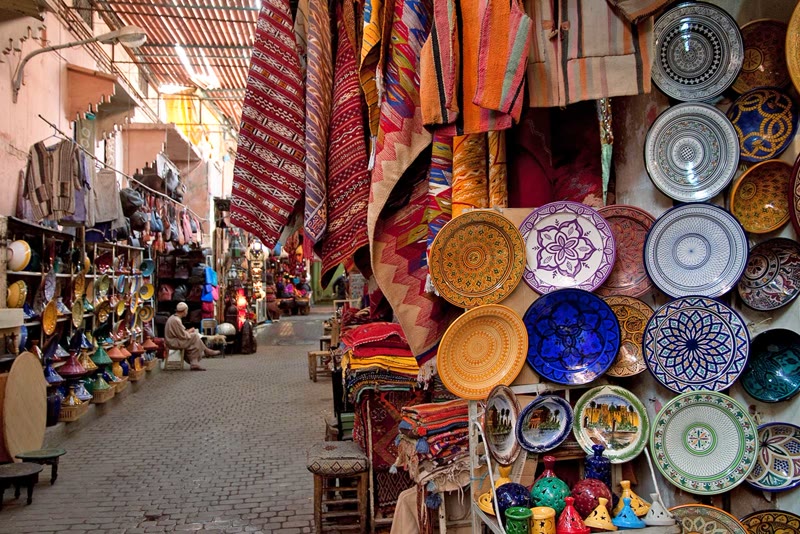 Colorful spice stalls and lanterns in the ancient souks of Marrakech's medina