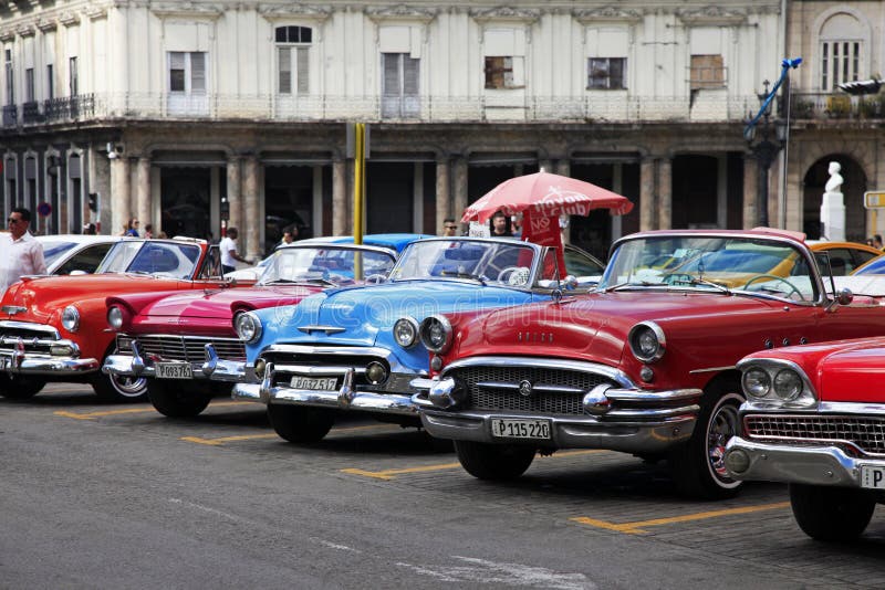 Classic American cars from the 1950s parked along Havana's colorful colonial streets