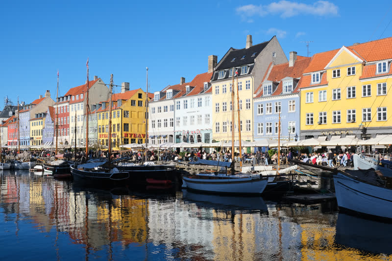 Copenhagen's colorful Nyhavn canal houses reflected in the water, one of Scandinavia's most iconic sights