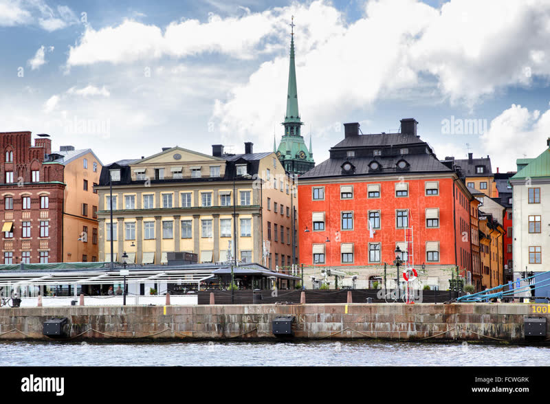 Stockholm's Gamla Stan old town waterfront with colorful buildings rising from the water