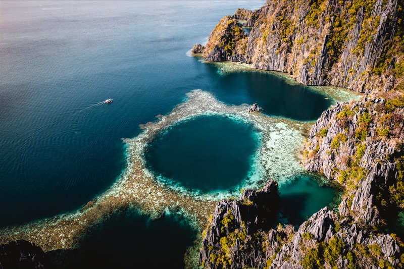El Nido Big Lagoon in Palawan — emerald waters with towering karst limestone formations