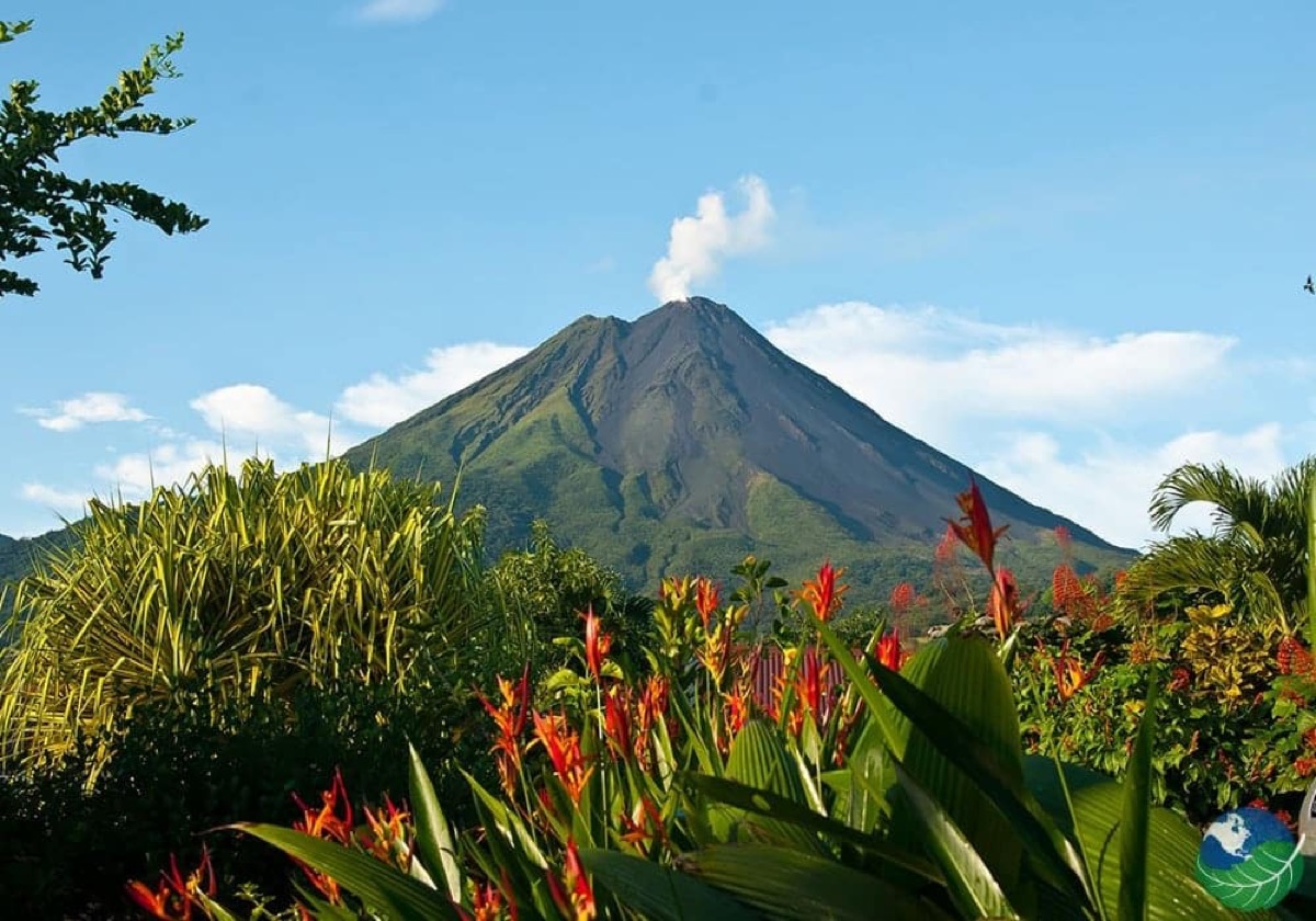 Arenal Volcano in Costa Rica rising above lush rainforest canopy