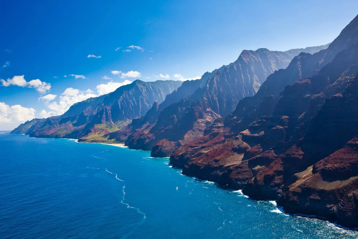 Na Pali Coast on Kauai, Hawaii — dramatic emerald cliffs plunging into the Pacific Ocean