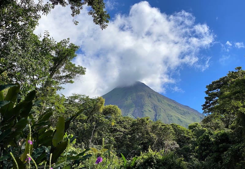 Arenal Volcano rising above Costa Rica's lush rainforest — one of Central America's most iconic sights