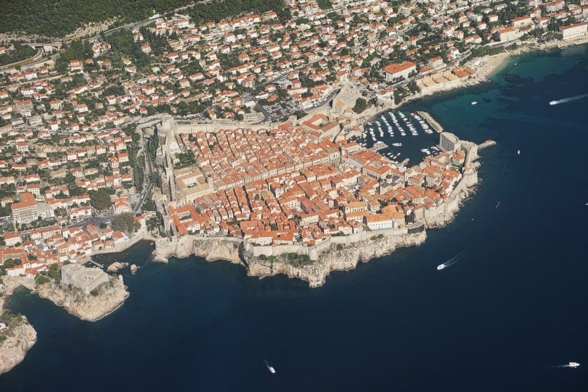 Aerial view of Dubrovnik Old Town, Croatia — terracotta rooftops and ancient city walls along the Adriatic