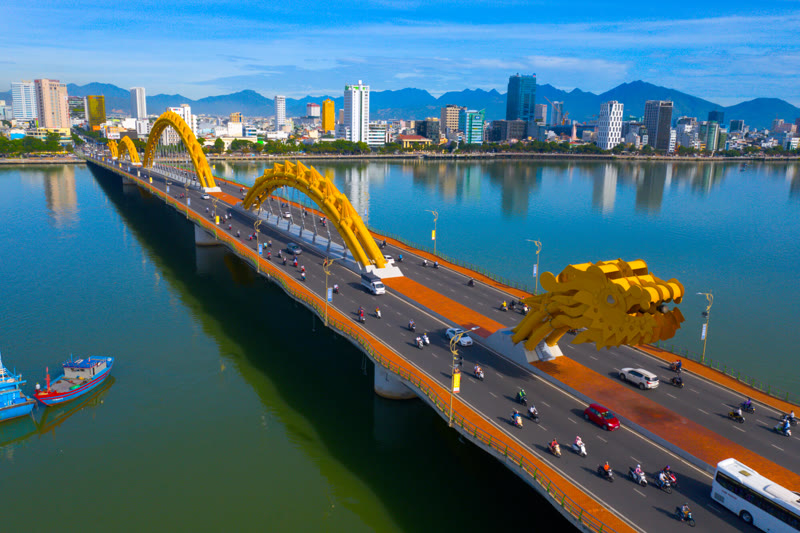Da Nang Vietnam Dragon Bridge at night illuminated in blue lights over the Han River