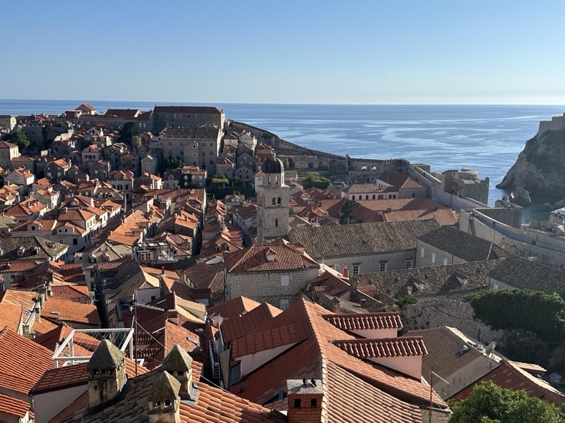 Aerial view of Dubrovnik's Old Town and medieval city walls jutting into the Adriatic Sea, Croatia