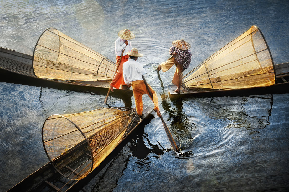 Inle Lake Myanmar — traditional Intha fishermen in early morning light on the lake