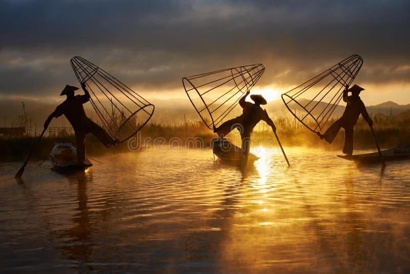 Inle Lake Myanmar stilted village houses reflected in calm water