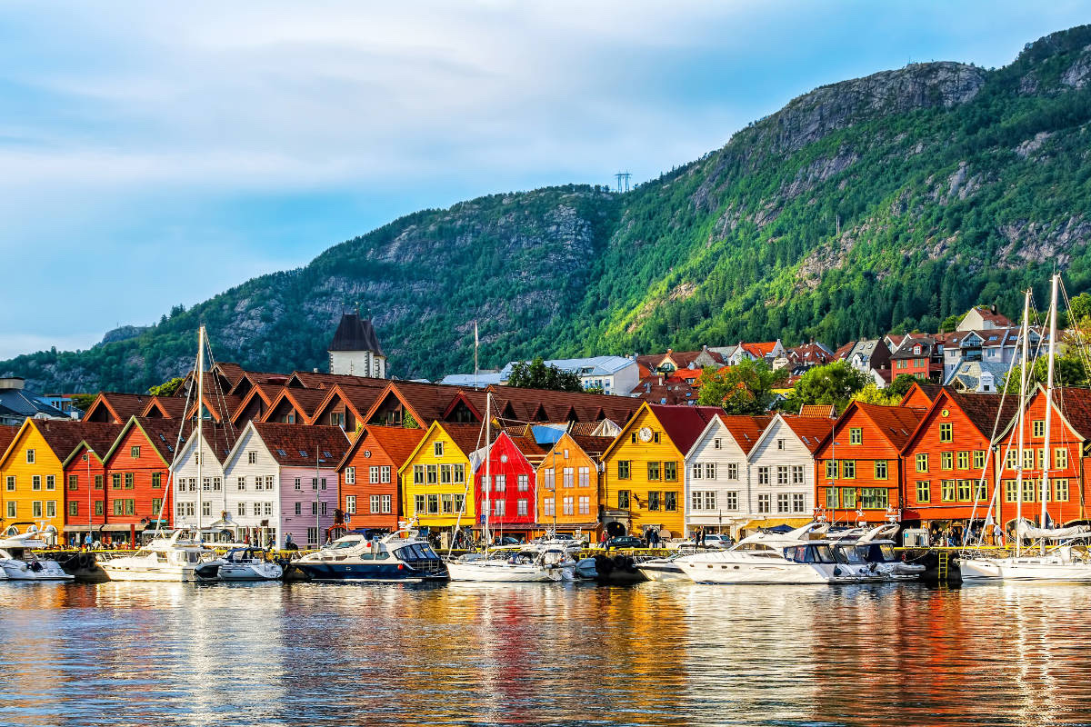 Bergen's Bryggen Wharf — colorful UNESCO-listed wooden houses reflected in the harbor
