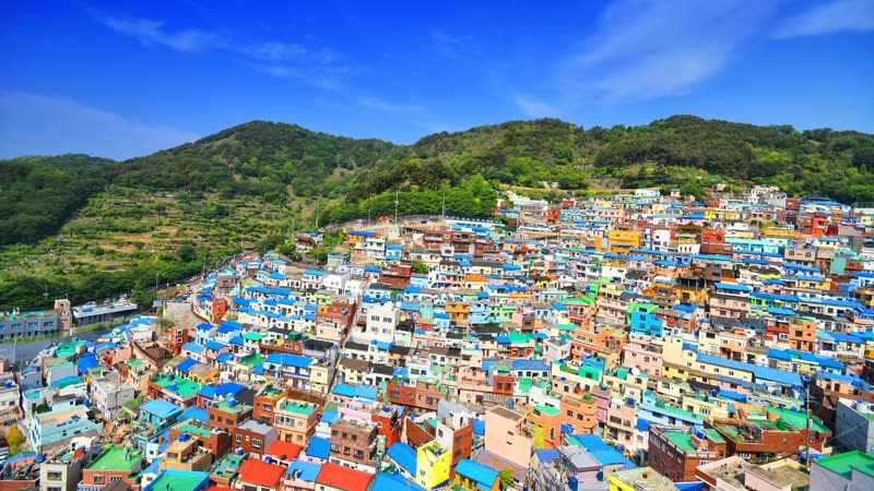 Gamcheon Culture Village in Busan — colorful hillside houses cascading down toward the sea