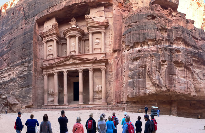 The Treasury at Petra, Jordan — carved into rose-red sandstone cliffs