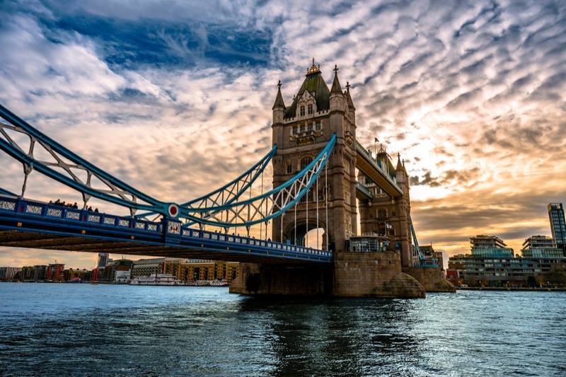 Tower Bridge illuminated over the River Thames at night, London