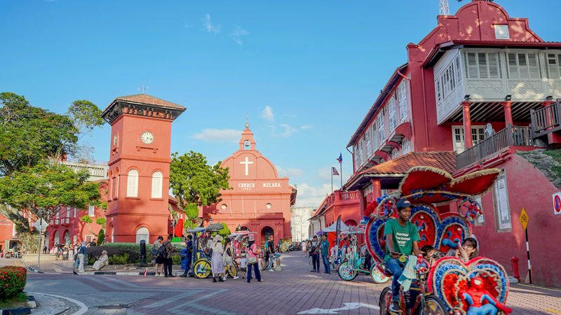 Malacca Dutch Square with Christ Church — iconic red colonial buildings in the heart of Malacca's UNESCO heritage zone