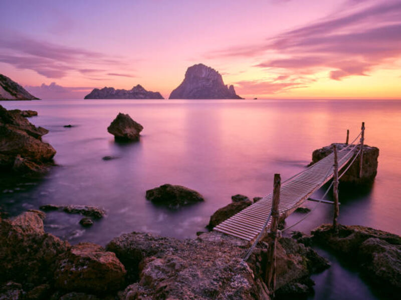 Es Vedrà — the mysterious rocky island off Ibiza's coast at sunset, one of the Mediterranean's most iconic views