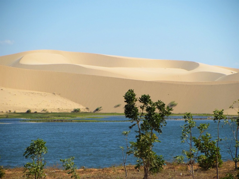 Mui Ne's iconic white sand dunes stretching along the coast of Binh Thuan province, Vietnam