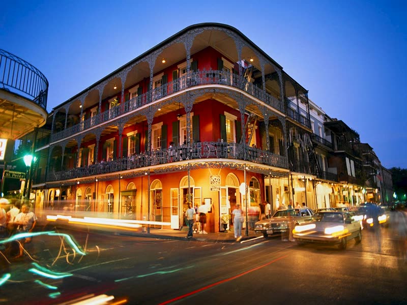 New Orleans French Quarter street scene with colorful architecture and balconies