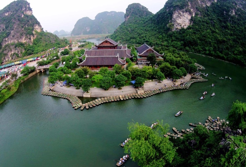 Trang An Landscape Complex in Ninh Binh — UNESCO World Heritage limestone karst peaks rising from emerald river channels