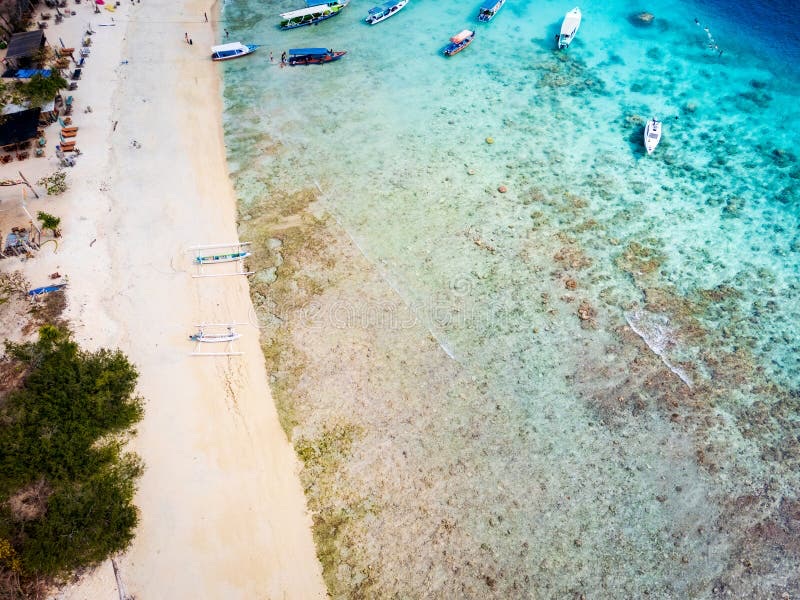 Aerial view of Gili Islands — three tiny islands in turquoise sea off Lombok