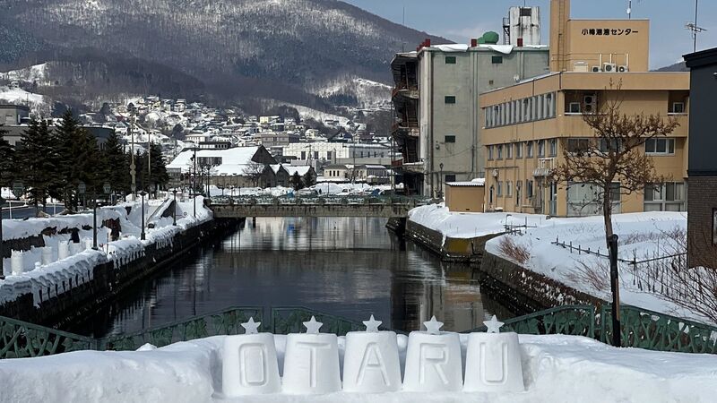 Otaru Canal at dusk with gas lamps reflected in the water — Hokkaido's most romantic scene