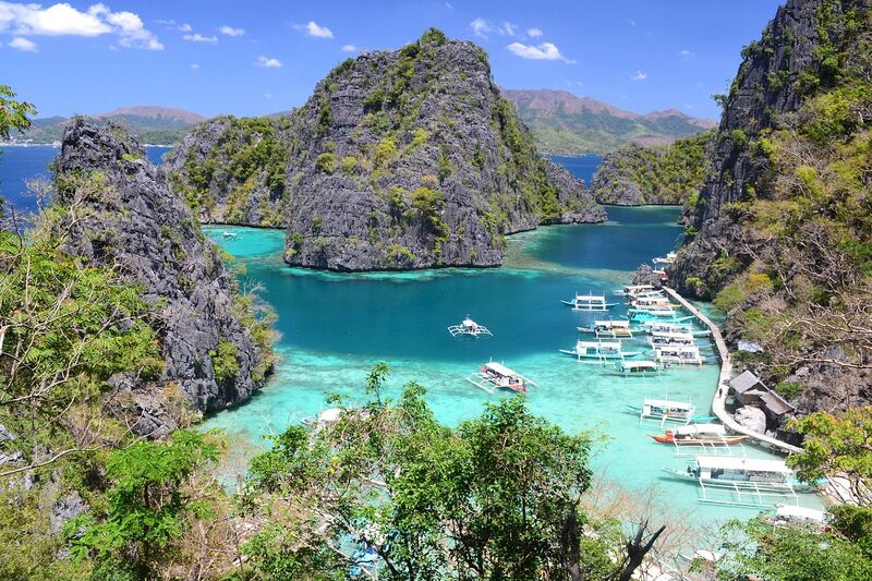 Kayangan Lake in Coron, Palawan — deep blue water inside a mountain, surrounded by forest