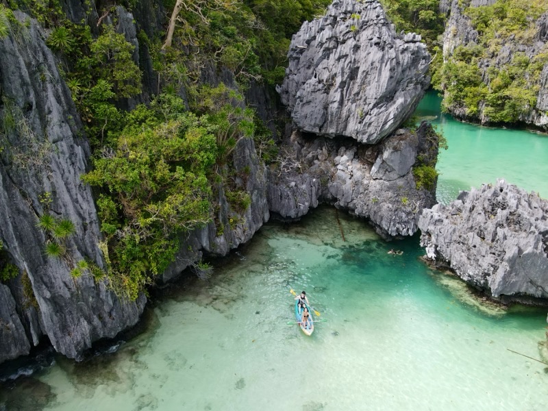 El Nido, Palawan, Philippines — turquoise lagoon surrounded by dramatic limestone karst cliffs