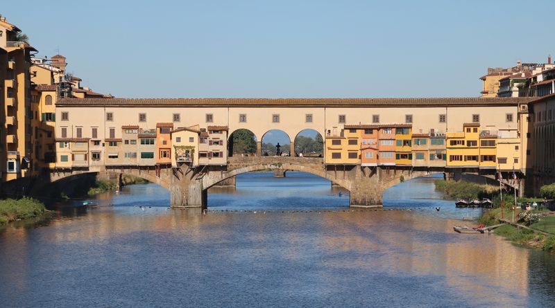 Ponte Vecchio bridge in Florence spanning the Arno River, lined with medieval jewelry shops