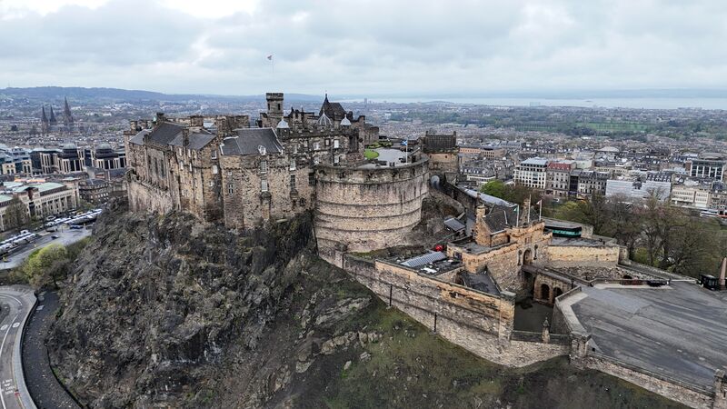 Edinburgh Castle perched dramatically on volcanic rock above the Scottish capital, one of Europe's most visited historic fortresses