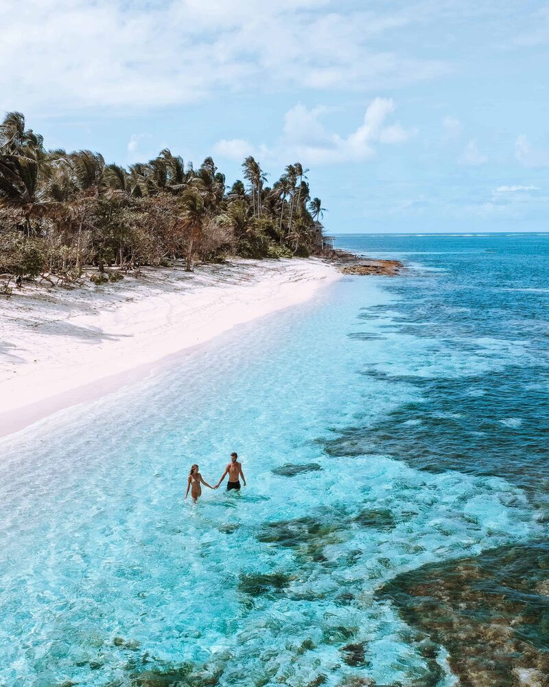 Siargao island beaches — white sand, palm trees, and turquoise water