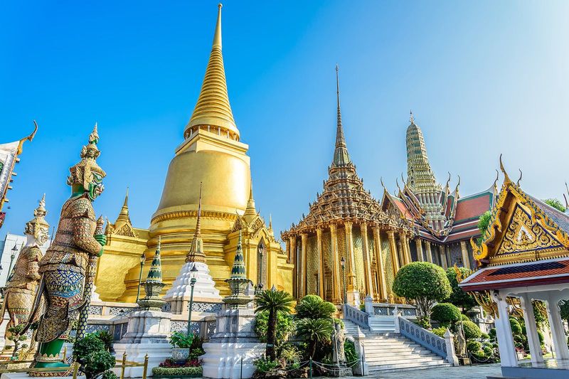 Bangkok's Wat Phra Kaew Grand Palace — golden spires and ornate Thai temple architecture in the royal precinct