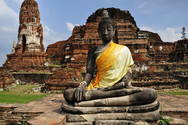 Buddha head entwined in banyan tree roots at Wat Mahathat, Ayutthaya