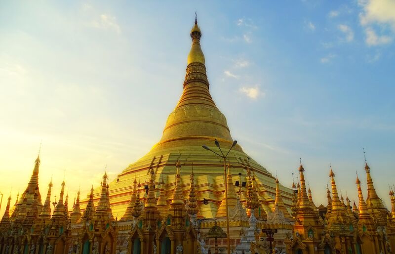 Yangon Myanmar — Shwedagon Pagoda golden stupa rising above the city, Myanmar's most sacred Buddhist site