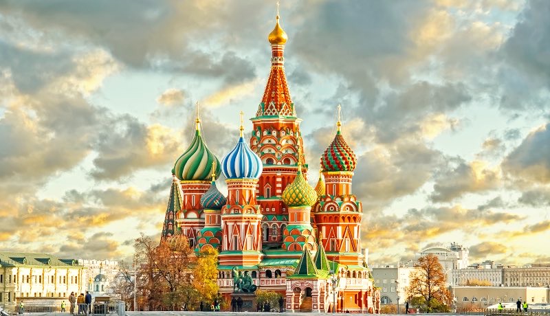 Vibrant St. Basil's Cathedral with its onion domes gleaming under a summer sky in Red Square.