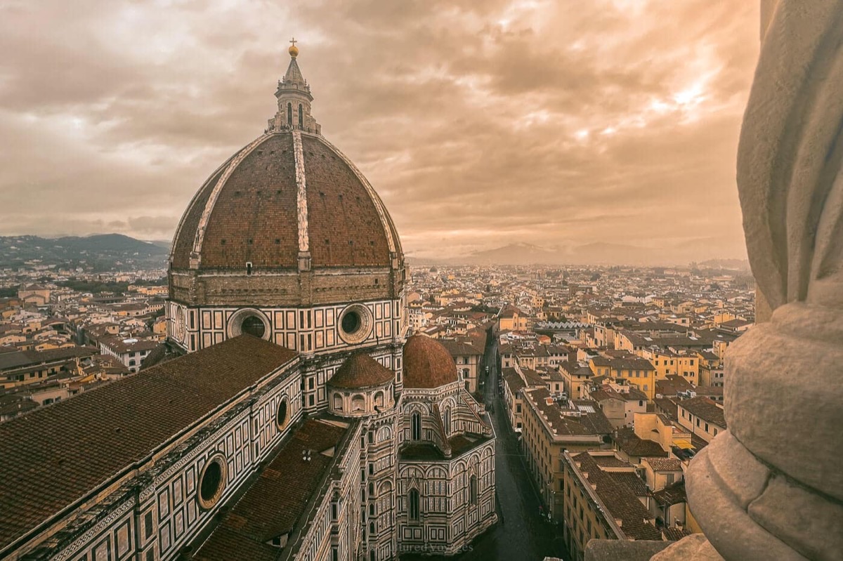 Florence Duomo cathedral with Brunelleschi's iconic dome at sunset