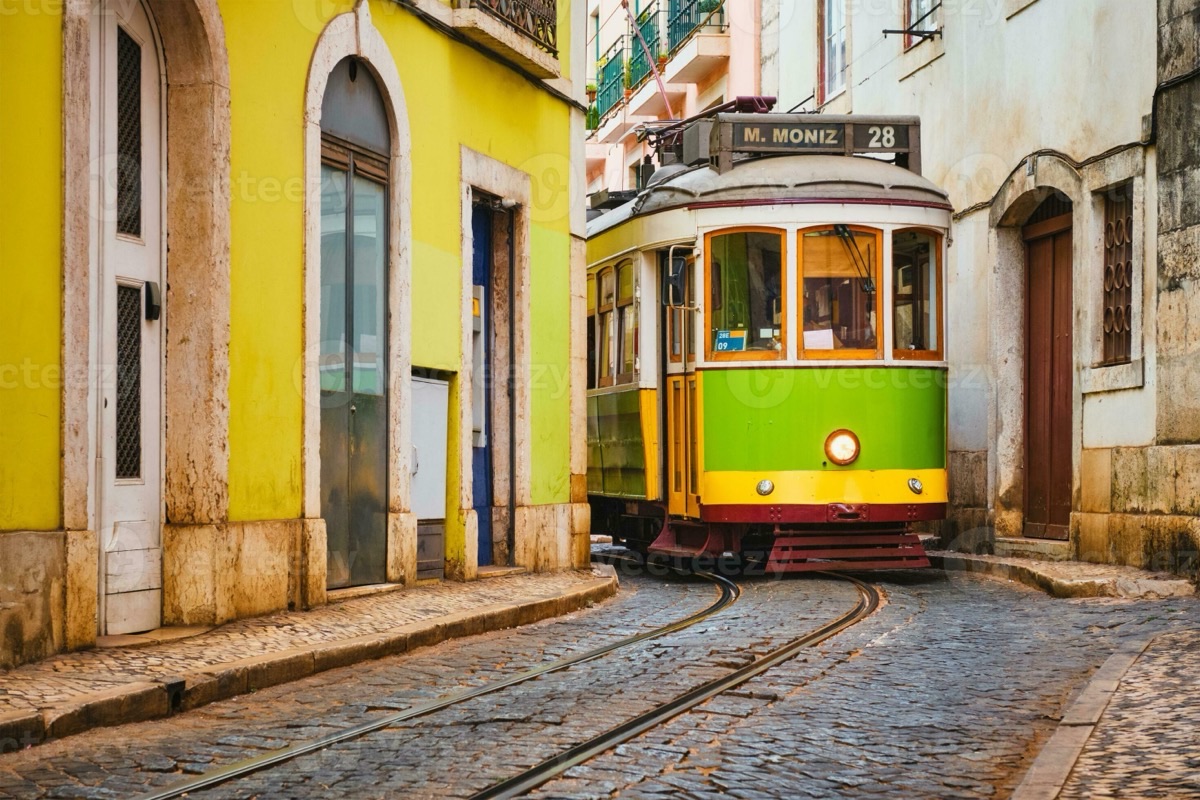 Tram 28 squeezing through a narrow cobblestone lane in Alfama, Lisbon