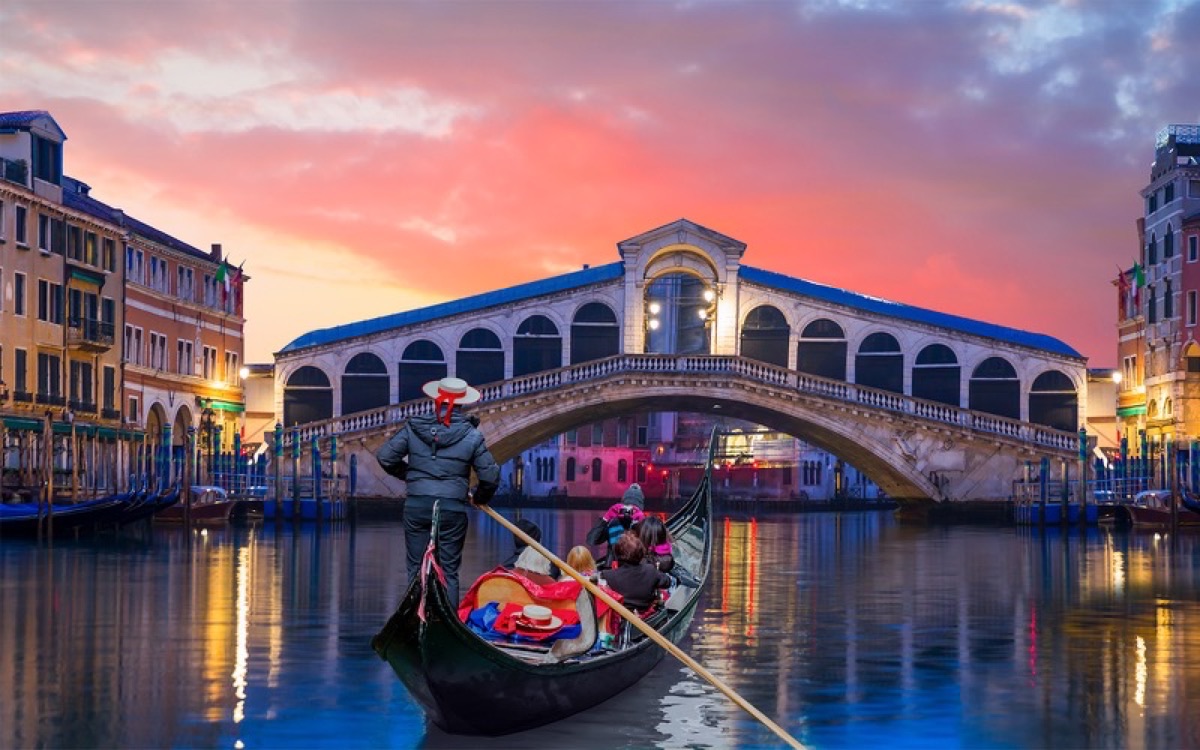 Gondolas on the Grand Canal at sunset, Venice Italy