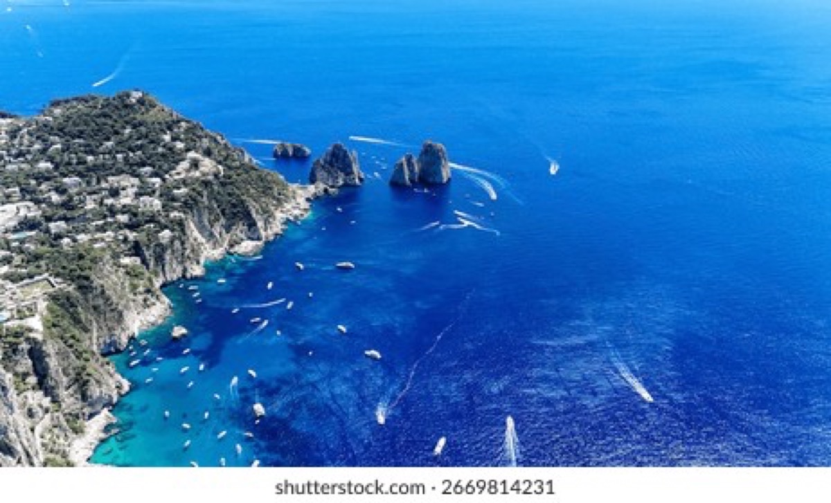 Faraglioni rocks rising from the turquoise sea, Capri Italy