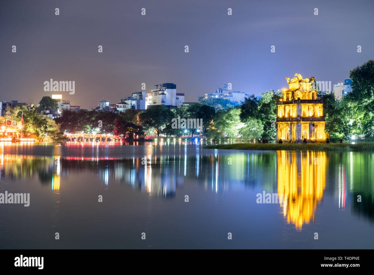 Turtle Tower reflected on the calm waters of Hoan Kiem Lake, Hanoi